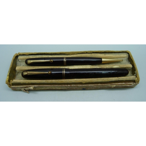 1125 - A Swan Mabie Todd fountain pen with 14ct gold nib, and a matching propelling pencil