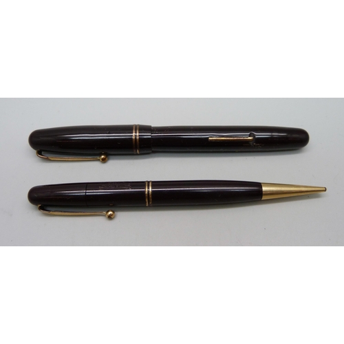 1125 - A Swan Mabie Todd fountain pen with 14ct gold nib, and a matching propelling pencil