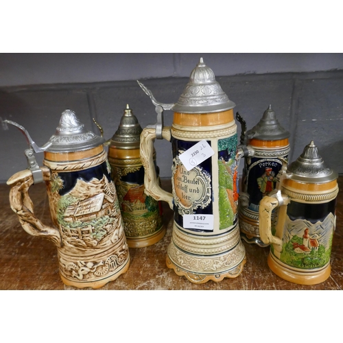 1147 - Five German pottery steins, three musical **PLEASE NOTE THIS LOT IS NOT ELIGIBLE FOR IN-HOUSE POSTIN... 