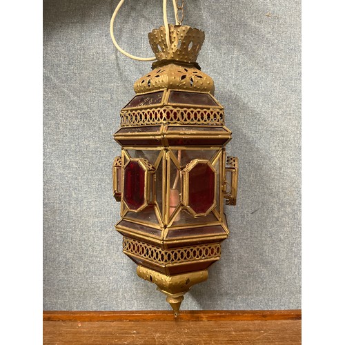 311 - An Eastern style metal and red glass lantern