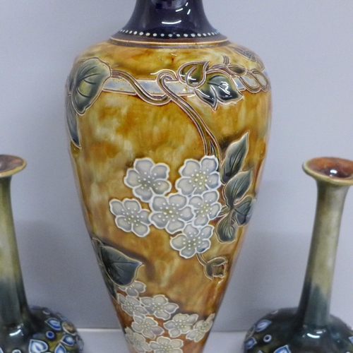 608 - A Royal Doulton stoneware vase, 7315 impressed mark to base, 32cm and a pair of Royal Doulton stonew... 