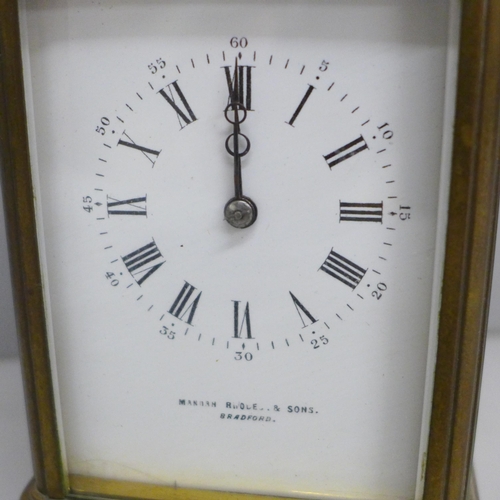 619 - A brass carriage clock, the dial marked Manoah Rhodes & Sons, Bradford