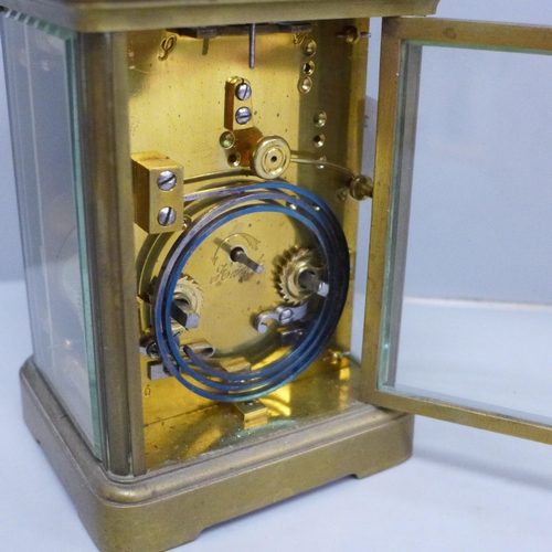 619 - A brass carriage clock, the dial marked Manoah Rhodes & Sons, Bradford