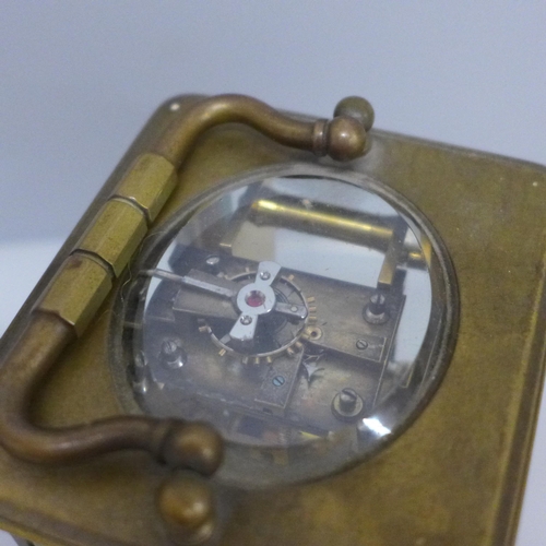 619 - A brass carriage clock, the dial marked Manoah Rhodes & Sons, Bradford