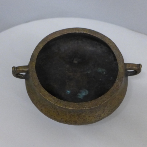 629 - A Chinese bronze twin handled censor, 13.5cm