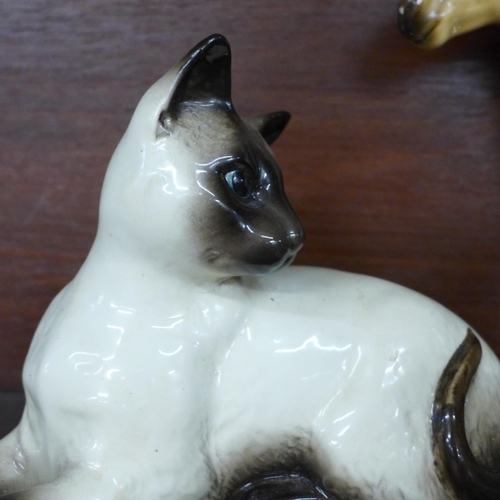 637 - A Beswick Siamese cat, a Beswick pony - ear and head restored, a Beswick duck, foal, Poppy Eyebright... 