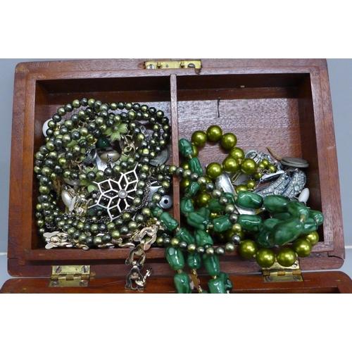 650 - Costume jewellery including silver in a polished wooden box