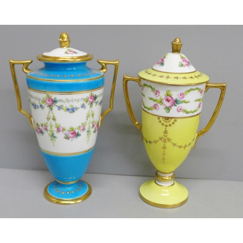 651 - Two Minton pedestal lidded vases, hand painted with swags and roses, gold and blue, and gold and yel... 