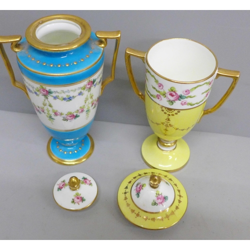 651 - Two Minton pedestal lidded vases, hand painted with swags and roses, gold and blue, and gold and yel... 