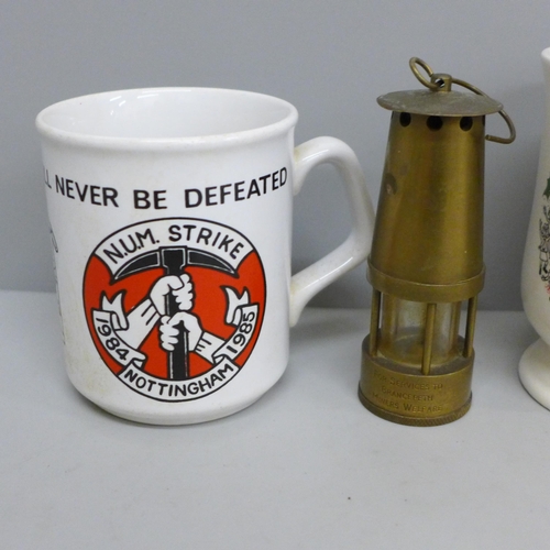 660 - Two commemorative miner's mugs and a miniature miner's lamp