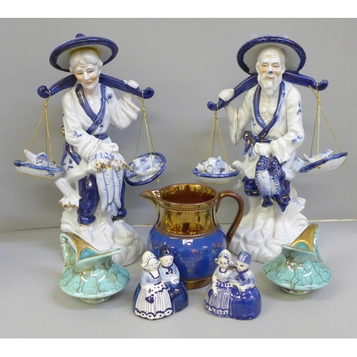 681 - Two Chinese blue and white figures, three small jugs and two Dutch figures