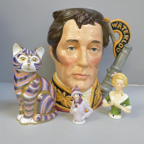 684 - A Royal Doulton Duke of Wellington character jug, a Royal Crown Derby cat paperweight with gold stop... 