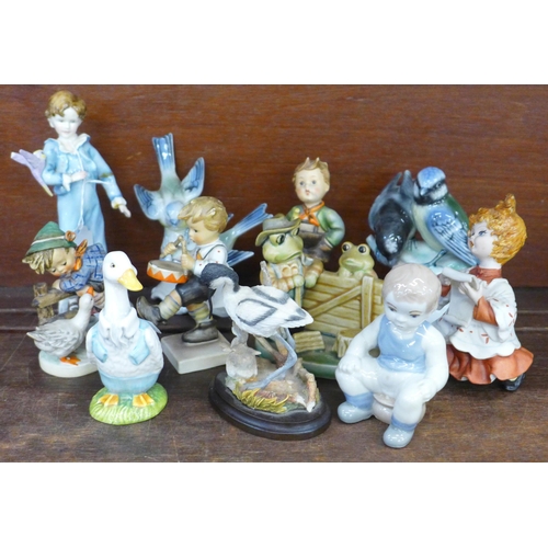 700 - A collection of figures including Hummel, Beswick Mr Drake Puddle-Duck, Royal Worcester parakeet, a/... 