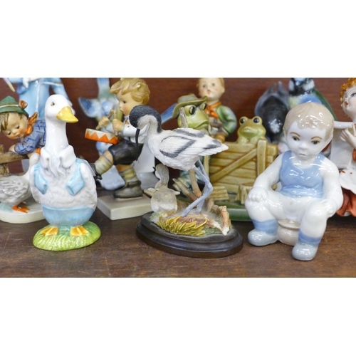 700 - A collection of figures including Hummel, Beswick Mr Drake Puddle-Duck, Royal Worcester parakeet, a/... 