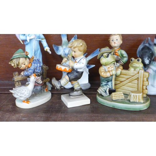 700 - A collection of figures including Hummel, Beswick Mr Drake Puddle-Duck, Royal Worcester parakeet, a/... 