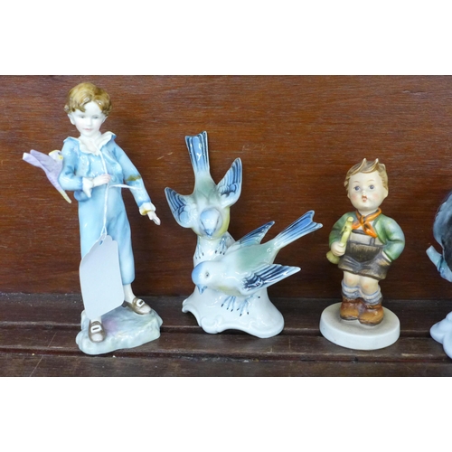 700 - A collection of figures including Hummel, Beswick Mr Drake Puddle-Duck, Royal Worcester parakeet, a/... 