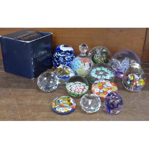 704 - Thirteen glass paperweights including Caithness and Millefiori