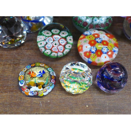 704 - Thirteen glass paperweights including Caithness and Millefiori