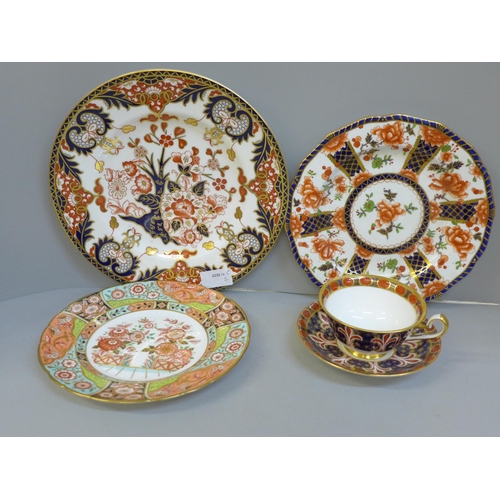 707 - Three Royal Crown Derby plates and a cup and saucer