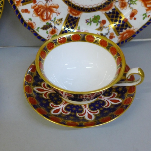 707 - Three Royal Crown Derby plates and a cup and saucer