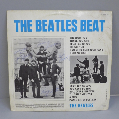 708 - A Beatles LP record, The Beatles Beat, 1964 with signatures rubber stamped to the back with provenan... 