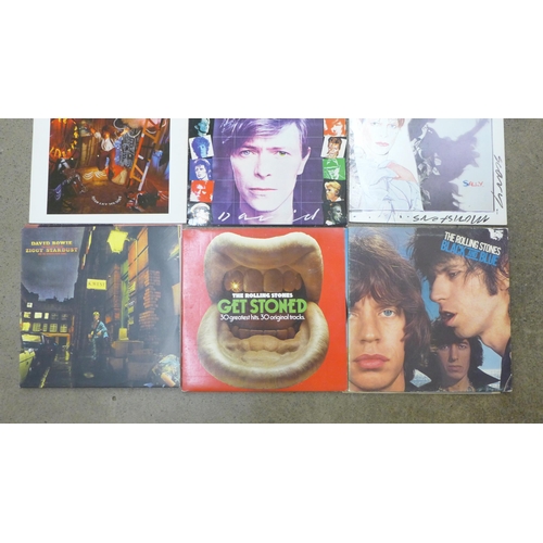 719 - A collection of 12 David Bowie and Rolling Stones LP records and 12