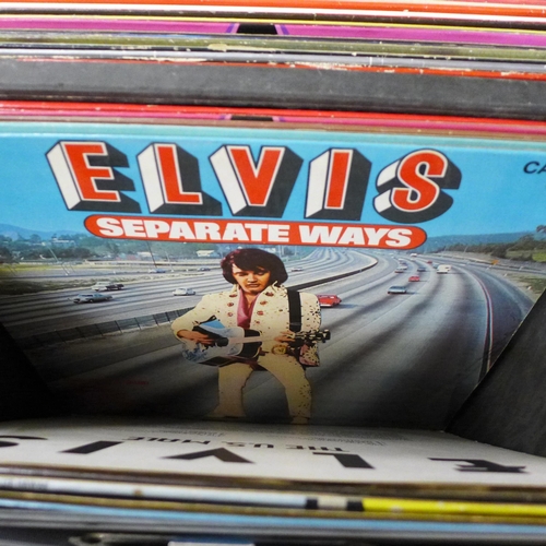 725 - A box of Elvis Presley LP records including re-issues, plus books and a DVD in a Sound Lab record ca... 