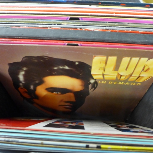 725 - A box of Elvis Presley LP records including re-issues, plus books and a DVD in a Sound Lab record ca... 