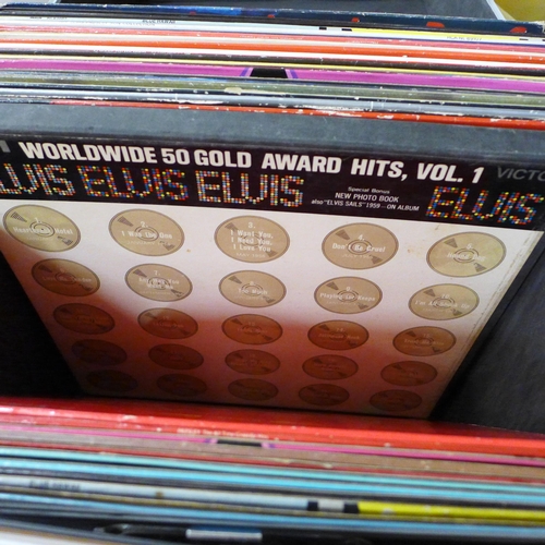 725 - A box of Elvis Presley LP records including re-issues, plus books and a DVD in a Sound Lab record ca... 