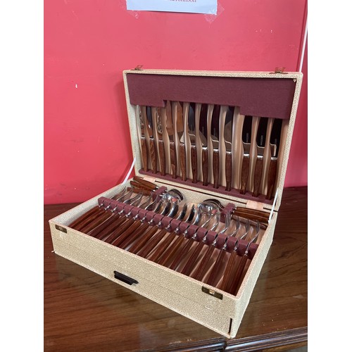 354 - A cased canteen of 'Glosswood' wooden handled cutlery