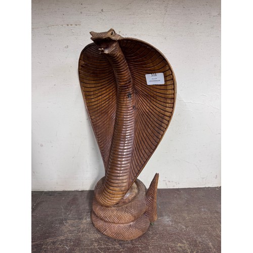 316 - A carved wood figure of a cobra