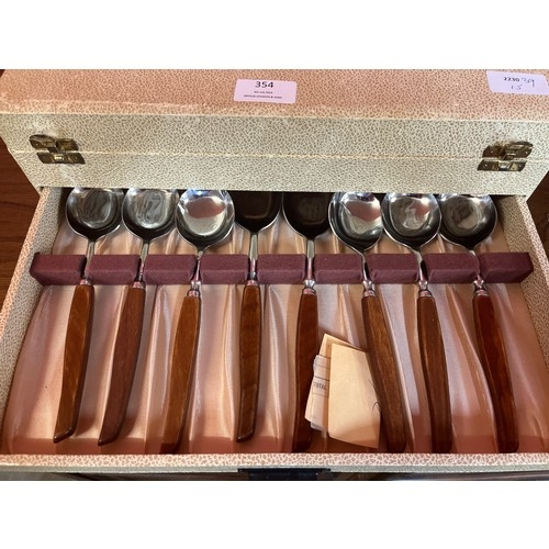 354 - A cased canteen of 'Glosswood' wooden handled cutlery