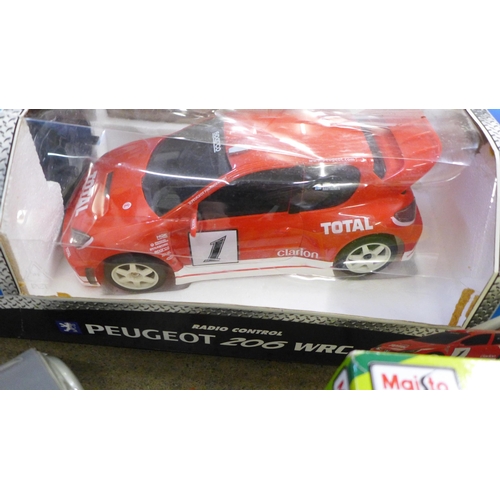 790 - A collection of model cars including Matchbox, Nikko Peugeout 206 WRC r/c car, Maisto, etc.