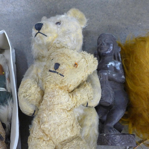 793 - A collection of carvings, dolls of the world and two vintage teddy bears