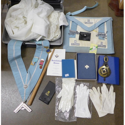 800 - A collection of Masonic items, one silver jewel, apron, sash, badges, Bible, gloves, etc.