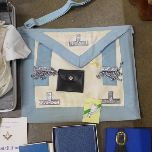 800 - A collection of Masonic items, one silver jewel, apron, sash, badges, Bible, gloves, etc.