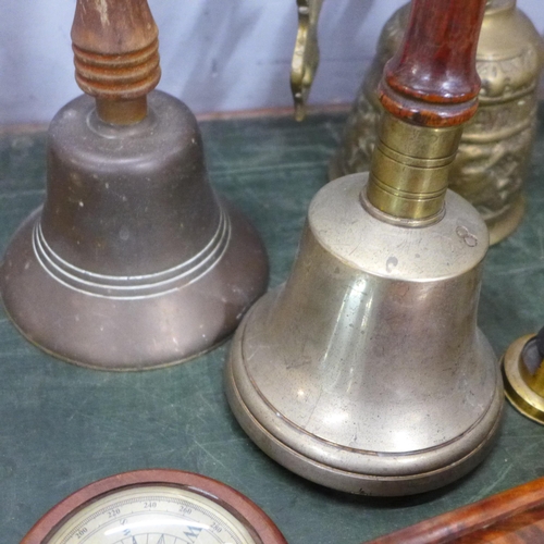 803 - A student's field microscope, three bells, carved walnut dominoes and a compass