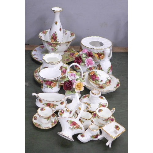 806 - A collection of Royal Albert Old Country Roses china including bowl, flower posies, bell, vase, etc.