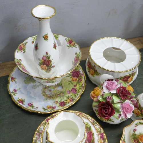 806 - A collection of Royal Albert Old Country Roses china including bowl, flower posies, bell, vase, etc.