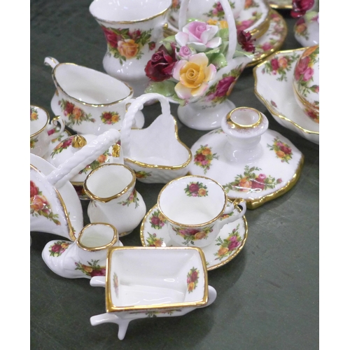 806 - A collection of Royal Albert Old Country Roses china including bowl, flower posies, bell, vase, etc.