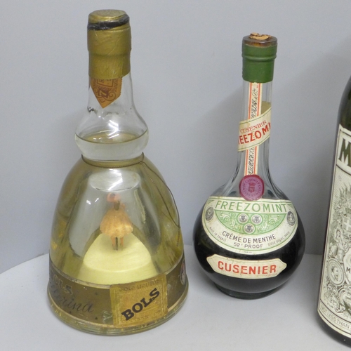 818 - Six bottles of alcohol - a 1968 Guntrum Riesling, a Berisford Soleva 1914 sherry, a Bols musical bal... 