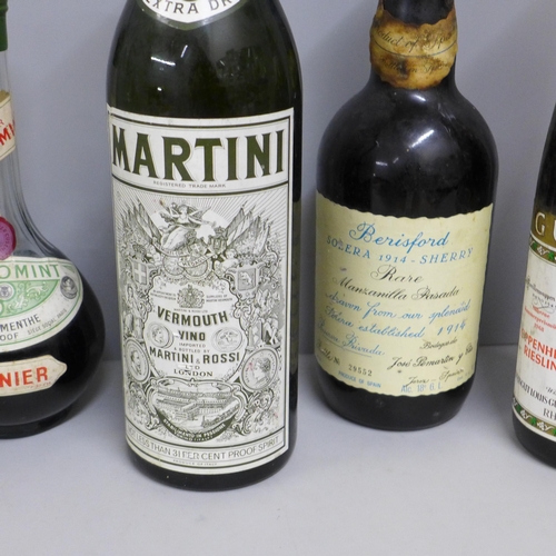 818 - Six bottles of alcohol - a 1968 Guntrum Riesling, a Berisford Soleva 1914 sherry, a Bols musical bal... 