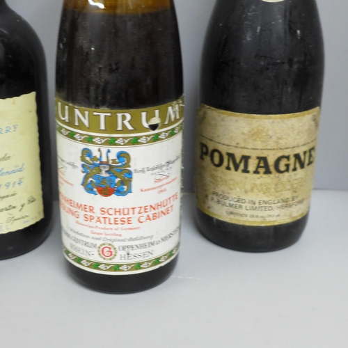 818 - Six bottles of alcohol - a 1968 Guntrum Riesling, a Berisford Soleva 1914 sherry, a Bols musical bal... 