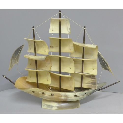 819 - A carved horn model ship