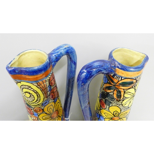 830 - A large pair of Studio vases, hand painted with maker's mark, JH, 37cm