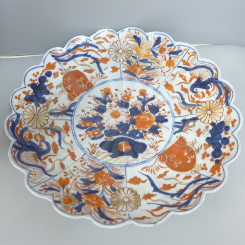 831 - An Imari charger, 32cm and a vase