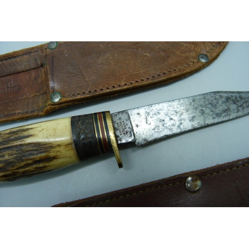 851 - Two knives with antler handles, one with integral tools and one marked Milbro Kampo, made in Sheffie... 