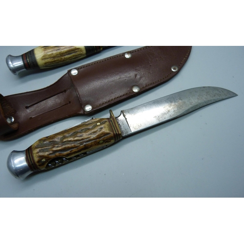 851 - Two knives with antler handles, one with integral tools and one marked Milbro Kampo, made in Sheffie... 