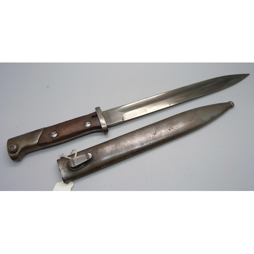 853 - A German bayonet 1884/1898, the scabbard marked Durkopp, the blade marked 7950, scabbard marked 1044