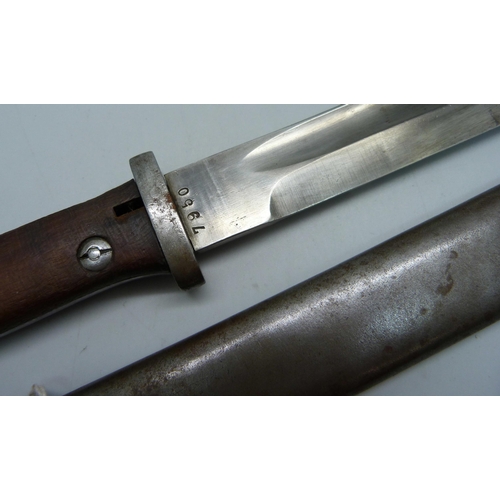 853 - A German bayonet 1884/1898, the scabbard marked Durkopp, the blade marked 7950, scabbard marked 1044